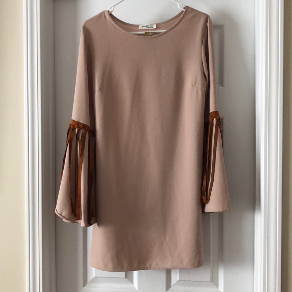 Cream boutique dress with leather tassel detail
